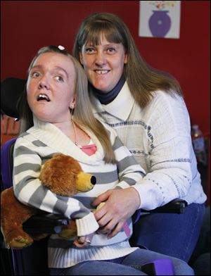 Brianna Burkett and her mother Yulinda Burkett pose at their home in Gibsonburg. Brianna has a rare genetic brain disease called Canavan Leukodystrophy.  Yulinda is holding a prom for Brianna.