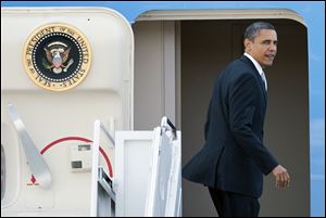 President Barack Obama on Tuesday boards Air Force One at Andrews Air Force Base, Md., enroute to Florida.