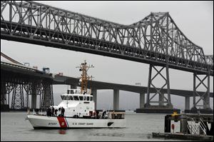 The Sockeye, a United States Coast Guard vessel backs away from Yerba Buena Island after refueling and heads back out to sea to search for four people missing off the Farallon Islands on Sunday in San Francisco, Calif. One person died and four others remain missing.