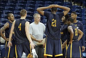 University of Toledo men's basketball team, shown here at a practice last season, gets post-season ban for poor academic scores progress. 