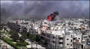 Amateur video shows an explosion amid heavy shelling in the Khaldiyeh area of Homs, Syria.