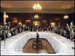  Guests sit down to a nine-course re-creation of the last meal served aboard the Titanic during the Maritime Academy of Toledo Foundation's remembrance of the 100th anniversary of the luxury liner's sinking, held April 14 at the Toledo Club.