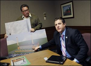 Developer David Ball, left, and YMCA President and CEO Todd Tibbits discuss their plans to relocate the Riverside YMCA to Water Street Station downtown.