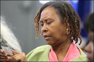 Linda Carter, waiting at the Providence Center, doesn’t mince words: ‘We need food, or we wouldn’t be here.’