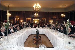 Guests sit down to a nine-course re-creation of the last meal served aboard the Titanic during the Maritime Academy of Toledo Foundation's remembrance of the 100th anniversary of the luxury liner's sinking, held April 14 at the Toledo Club.