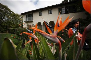 Bird of Paradise blooms frame a front yard view of the Winter House, built in 1925, an 'old world' Mediterranean estate designed by architect Ray J. Kieffer. The home in Beverly Hills, California, is on the market for the first time in 87 years.
