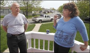 Charles Grasser and Marian Parkins, residents of the Westbrook mobile-home park in South Toledo, discuss the lack of shelters.