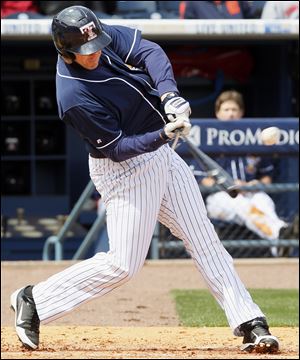 Mud Hens designated hitter Brad Eldred (44) breaks his bat on a single RBI against the Columbus Clippers during the third inning Sunday at Fifth Third Field in Toledo, Ohio.