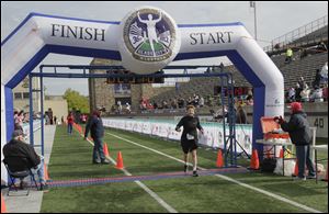 Ann Fleck, 75, of Toledo, finishesing the half marathon.