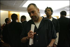 Elhadi Robbins leaving court after his arraignment in 2010.