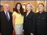 From left, Pat Stark, Nikki Bragg, Marianne Ballas, and Tim Mathews at the Ottawa Hills home of Mrs. Ballas for a fund-raiser for area charities.