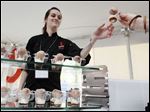 Amanda Rockman, a pastry chef with two Chicago restaurants, serves desserts in the giant tent.