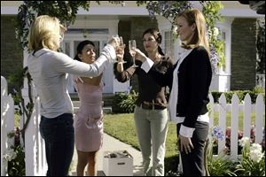 From left, Felicity Huffman, Eva Longoria, Teri Hatcher and Marcia Cross toasting one another in a scene from ABC's 