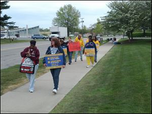 Striking blood-service staff, members of United Food and Commercial Workers Local 75, picket the Red Cross on Executive Parkway. 