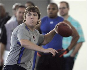 Kellen Moore works out for scouts during Boise State's Pro Day in March. Most teams were concerned by his height and arm strength.