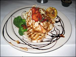 Grilled wild swordfish topped with strawberry chutney and balsamic glaze.