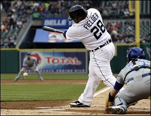 Detroit Tigers' Prince Fielder hits a grounder to first on which two runs scored, against the Kansas City Royals in the first inning of a baseball game in Detroit, Tuesday.