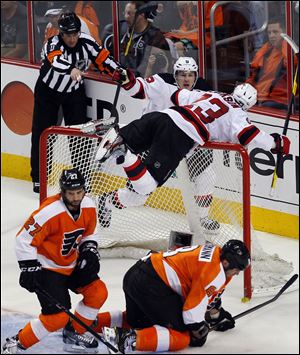 New Jersey's David Clarkson crashes into the net after scoring what turned out to be the game-winning goal.