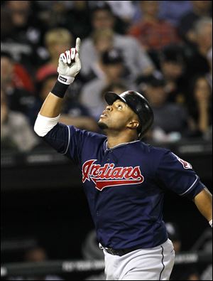 Carlos Santana celebrates his three-run home run to help give Cleveland the lead in the fifth inning Wednesday night.