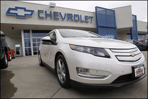 A 2012 Chevrolet Volt is parked outside at a Chevrolet dealership in the south Denver suburb of Englewood, Colo.