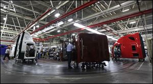 Workers assemble Freightliner trucks at a plant in Cleveland, N.C. 