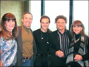 It was a wonderful night of fun and music with family and friends to benefit the American Heart Association. Hosts Jo-Jo and Stu Goldberg, left, chat with featured entertainer Joe Vitale and his wife Suzie right, and son Joe, Jr., center.