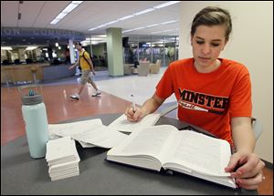 Abby Knapke, 22, a graduating senior at the University of Toledo, studies for an exam. She says that she's not too worried about the looming job search, but other recent graduates are looking at a still-fragile economy and slow job growth.