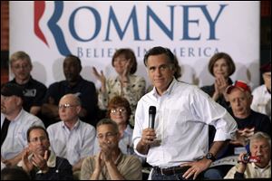 Republican presidential candidate, former Massachusetts Gov. Mitt Romney listens to a question from a supporter at a town hall-style meeting in Euclid, Ohio.