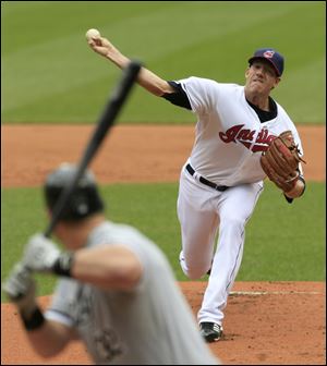 Cleveland Indians starting pitcher Zach McAllister, right, throws to Chicago White Sox's Adam Dunn in the first inning.