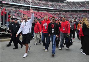 Ohio State Buckeyes head coach Urban Meyer waves to fans as he walks off the field after the Ohio State Buckeyes Scarlet vs Grey spring game.