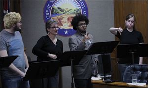 From left, Sandy Kimmel, Ben Jones and Brittany Green act in the play Market and Washington: Tiffin In Its Own Words,  during a Tiffin city council meeting at the Tiffin Municipal Building in Tiffin, Ohio. There were 8 actors from Heidelberg University.