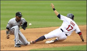 Cleveland Indians' Shin-Soo Choo, right, steals second base as Chicago White Sox's Alexei Ramirez waits for the ball in the second inning in the first baseball game of a doubleheader in Cleveland. The Indians won 8-6.