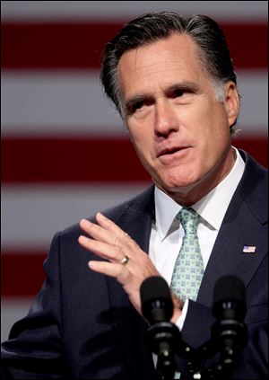 Republican presidential candidate, former Massachusetts Gov. Mitt Romney speaks at Lansing Community College in Lansing, Mich., Tuesday. He is being blasted for comments he made in Ohio claiming he supported the bailout of the auto industry in 2009.
