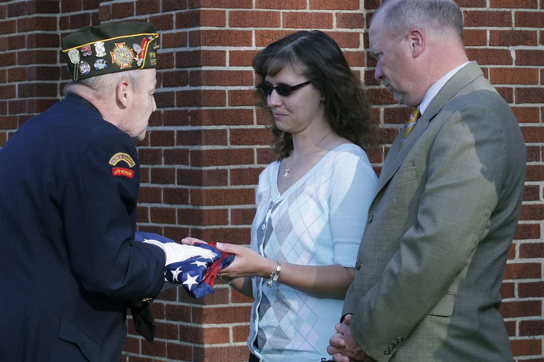VFW-9963-commander-Jim-Dolan-presents-the-flag-that-flew-outside-of-the-school