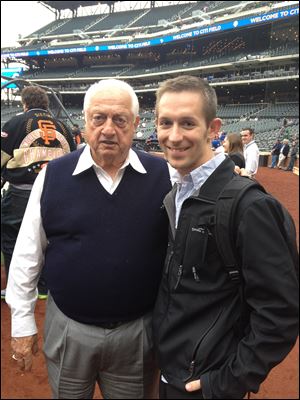 RJ Breisacher meets with Tommy Lasorda, a former Major League Baseball player and manager, during Mr. Breisacher's travels to the league's 30 parks. So far, Mr.  Breisacher has visited Detroit, Cleveland, Cincinnati, Pittsburgh, Toronto, Boston, Baltimore, Tampa, and both Yankee Stadium and Citi Field in New York.