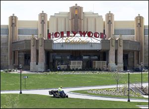 yA worker mows grass outside of the Hollywood Casino on the Maumee River. The site is expected to open May 29, 15 days after Ohio's first casino is to open in Cleveland.