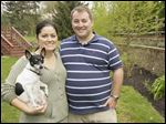  Natalie Rivera and Joseph Walsh, with one of their two dogs, Annie.  Joe Walsh and Natalie Rivera began gardening when they moved to their house in 2010 in Sylvania Township, Ohio.
