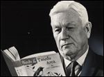  Lou Campbell peruses a copy of his 1968 book, 'Birds of the Toledo Area.' He began researching and documenting the bird population in the Toledo area in 1926, and in 1940 he crafted a comprehensive guide called 'The Birds of Lucas County,' which was published by the Toledo Zoological Society. The 1968 updated and revised text was published by The Blade.