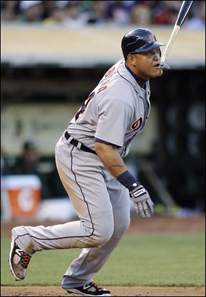 Detroit Tigers' Miguel Cabrera watches his RBI double off Oakland Athletics' Bartolo Colon during the third inning Thursday night.