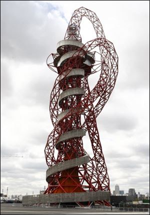 The ArcelorMittal Orbit sculpture before its official unveiling at the Olympic Park, London. The steel sculpture designed by Anish Kapoor and Cecil Balmond stands 114.5 meters (376ft) high, 63% of of the sculpture is recycled steel and incorporates the five Olympic rings.
