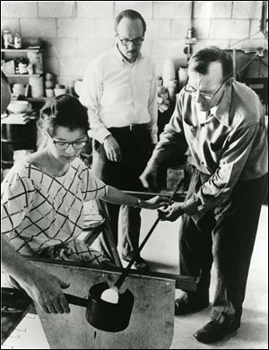 Rosemary Gulassa, Harvey Littleton, center, and Harvey Leafgreen take part in the 1962 glass art workshop at the Toledo Museum of Art.