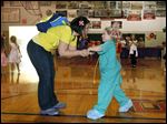  Laura Burkholder of Lambertville, dances with 5-year-old daughter, Megan, during a Freaky Friday event at Bedford Junior High School. The event, in recognition of Mother's Day, encouraged youngsters in kindergarten through eighth grade to try out being mom for a day and invited mothers, grandmothers, and aunts to be children again.