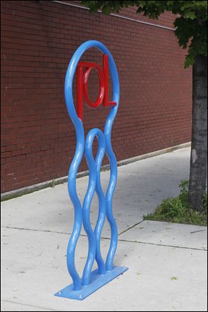 Bike racks located on 17th Street, left, at the corner of Adams Street in front of Manos’ Restaurant, and on the 1800 block of Adams Street in front of Ottawa Tavern.