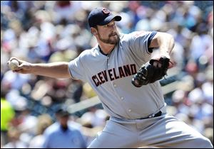 Cleveland Indians pitcher Derek Lowe throws against the Minnesota Twins in the first inning of a baseball game, Tuesday, May 15, 2012, in Minneapolis.