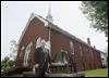  The Rev. David Stogsdill stands in front of Grace Bible Baptist Church, one of the oldest structures in Walbridge. The church, on Union Street, was built in 1890. 