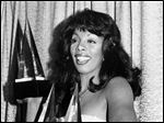  In this Jan. 12, 1979, photo, Donna Summer poses with three awards she won at the American Music Awards in Los Angeles.