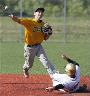 Clay's JJ Miller (4) makes a play against St. John's Jesuit's Nolan Silberhorn (22) in the fourth inning.