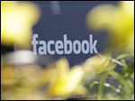  Flowers surround a sign outside of Facebook headquarters in Menlo Park, Calif., Friday, May 18, 2012. Facebook CEO Mark Zuckerberg rang the bell inside Facebook headquarters. (AP Photo/Paul Sakuma)