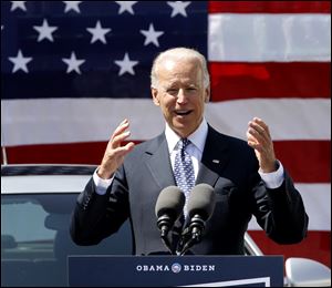 Vice President Joe Biden speaks before supporters during a campaign stop at a car dealership in Martins Ferry on Thursday. It was the Democrat's second day of campaigning in Ohio.  