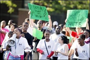 About 150 young people led by the Scott High School band join with Toledo's city leaders in the Old West End on Thursday for a rally to denounce gang violence. The goal was to offer a positive message and let residents know most youths are against crime and want to help stop it.